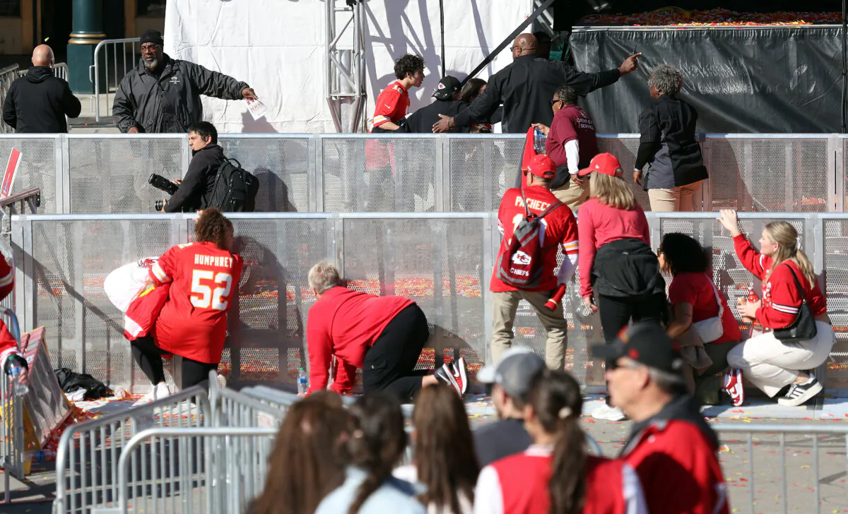 People take cover during a shooting at Union Station during the Kansas City Chiefs Super Bowl LVIII victory parade in Kansas City, Mo., on Feb. 14, 2024. (Jamie Squire/Getty Images)