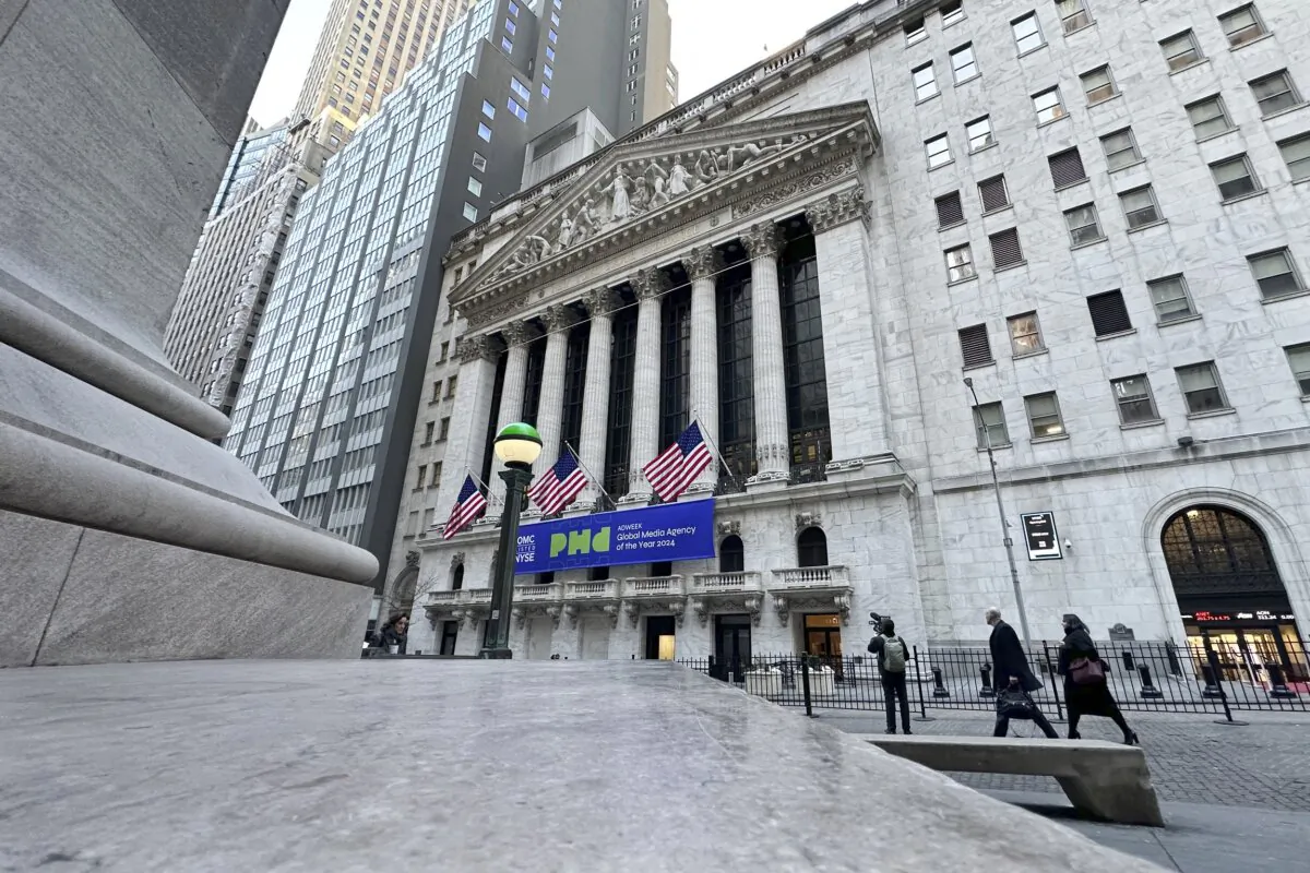 Pedestrians pass the New York Stock Exchange in New York on Feb. 20, 2024. (Peter Morgan/AP Photo)