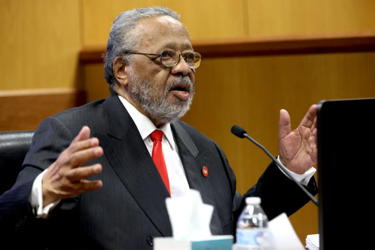 John Floyd III, father of Fulton District Attorney Fani Willis, speaks at the witness stand during a hearing in the case of the State of Georgia v. Donald John Trump at the Fulton County Courthouse in Atlanta on Feb. 16, 2024. (Alyssa Pointer/Pool via Getty Images)