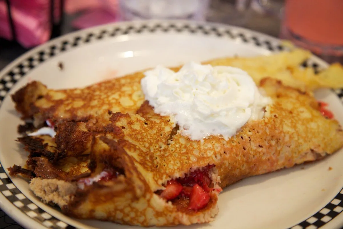 Pamela's Diner's hotcakes are thinner than typical fluffy pancakes, and they come out plate-sized with crispy edges. (Emily Goodstein/Wikimedia Commons via CC BY 2.0)