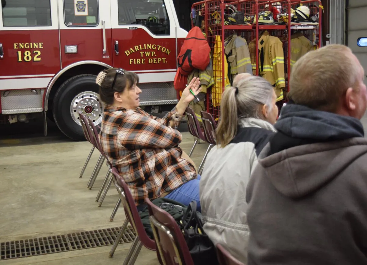 Lori O’Connell asks questions during an informational tax meeting at the firehouse in Darlington, Penn., on Feb. 19, 2024. (Beth Brelje/The Epoch Times)