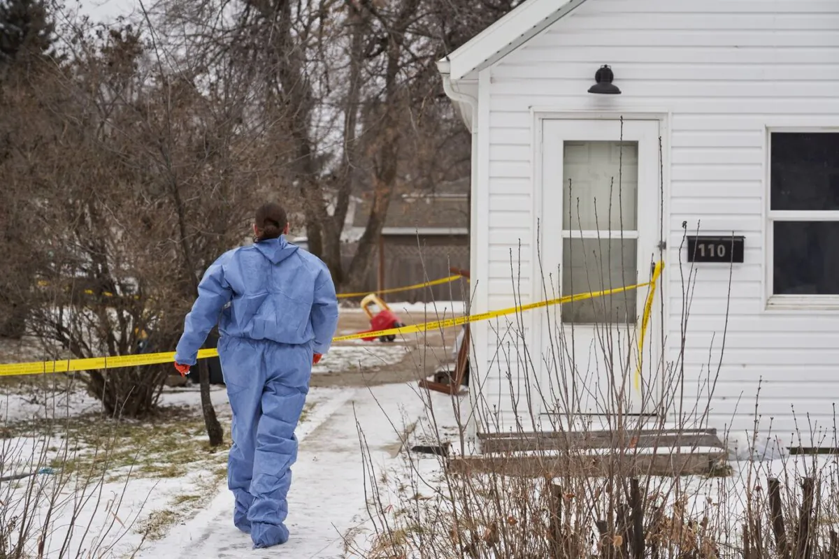 Forensic investigators on the scene of an ongoing investigation regarding five deaths in southern Manitoba, in Carman, Man., on Feb. 12, 2024. (The Canadian Press/David Lipnowski)