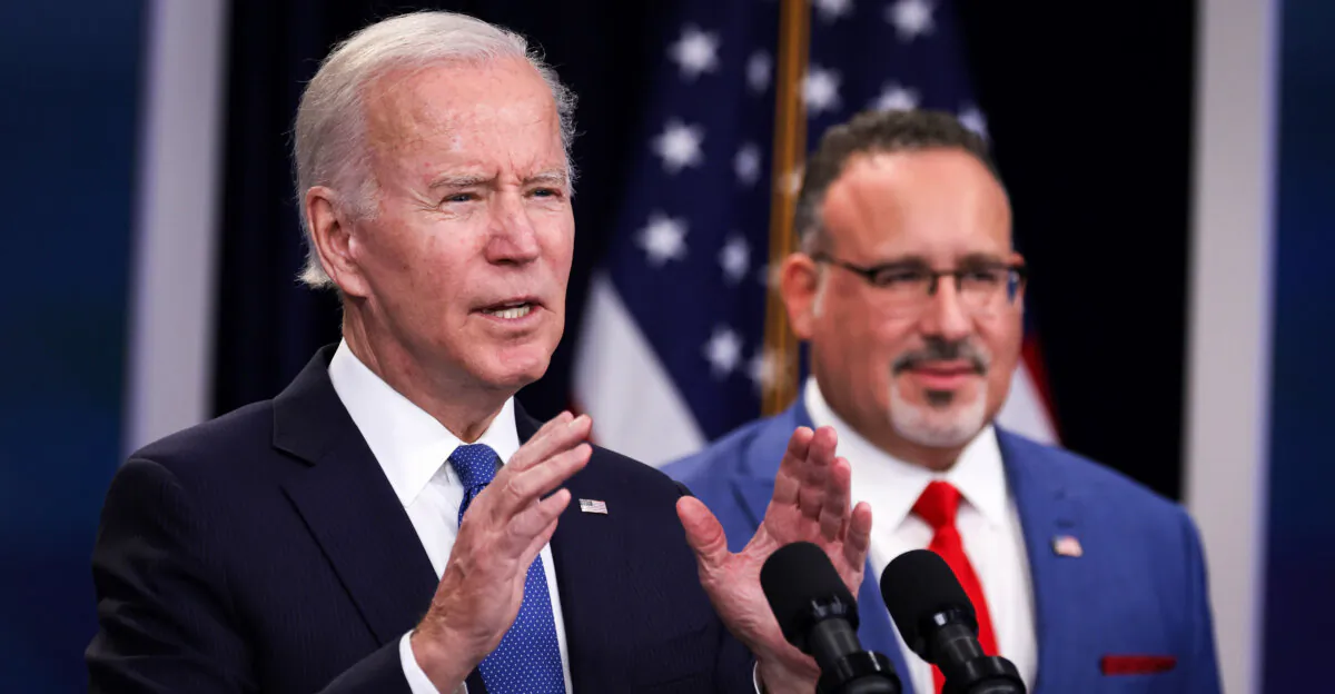 President Joe Biden speaks on a previous student debt relief scheme as Education Secretary Miguel Cardona looks on in Washington on Oct. 17, 2022. (Alex Wong/ Getty Images)