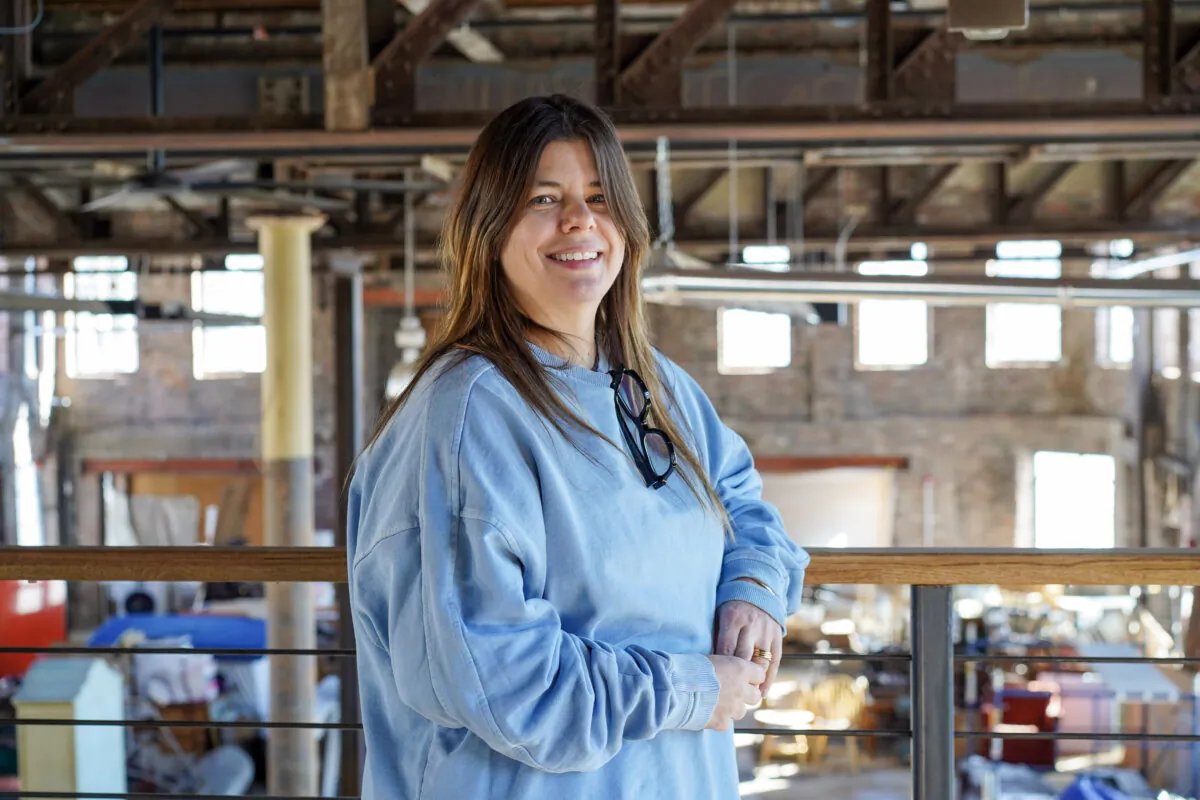 Anne Rogers at the future R.H. Smith Mercantile in downtown Port Jervis, N.Y., on Feb. 19, 2024. (Cara Ding/The Epoch Times)