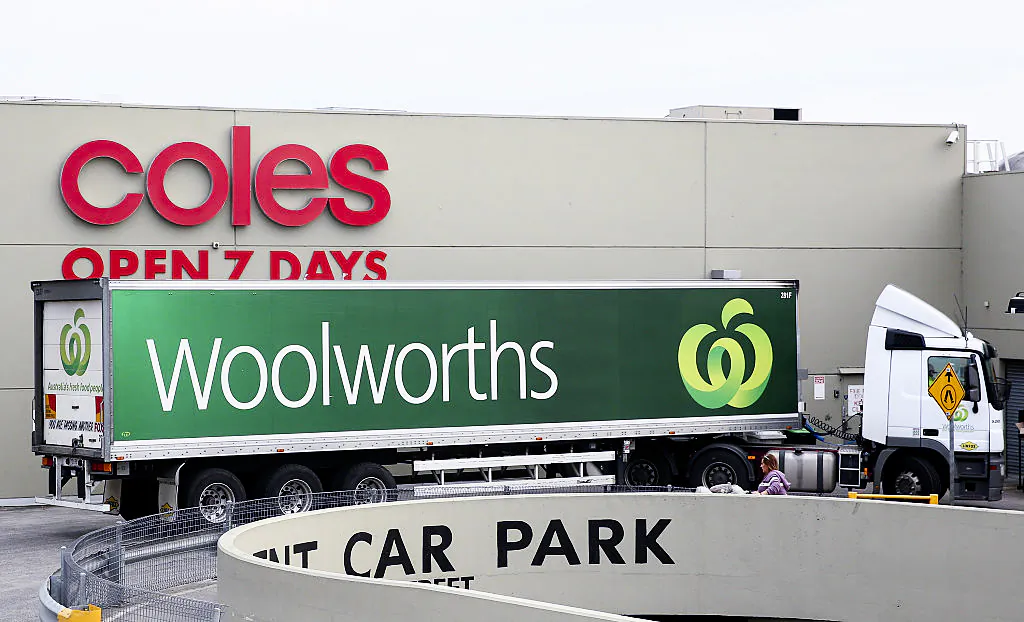 A Woolworths truck is parked outside a Coles Supermarket on May 25, 2015 in Melbourne, Australia. (Photo by Quinn Rooney/Getty Images)