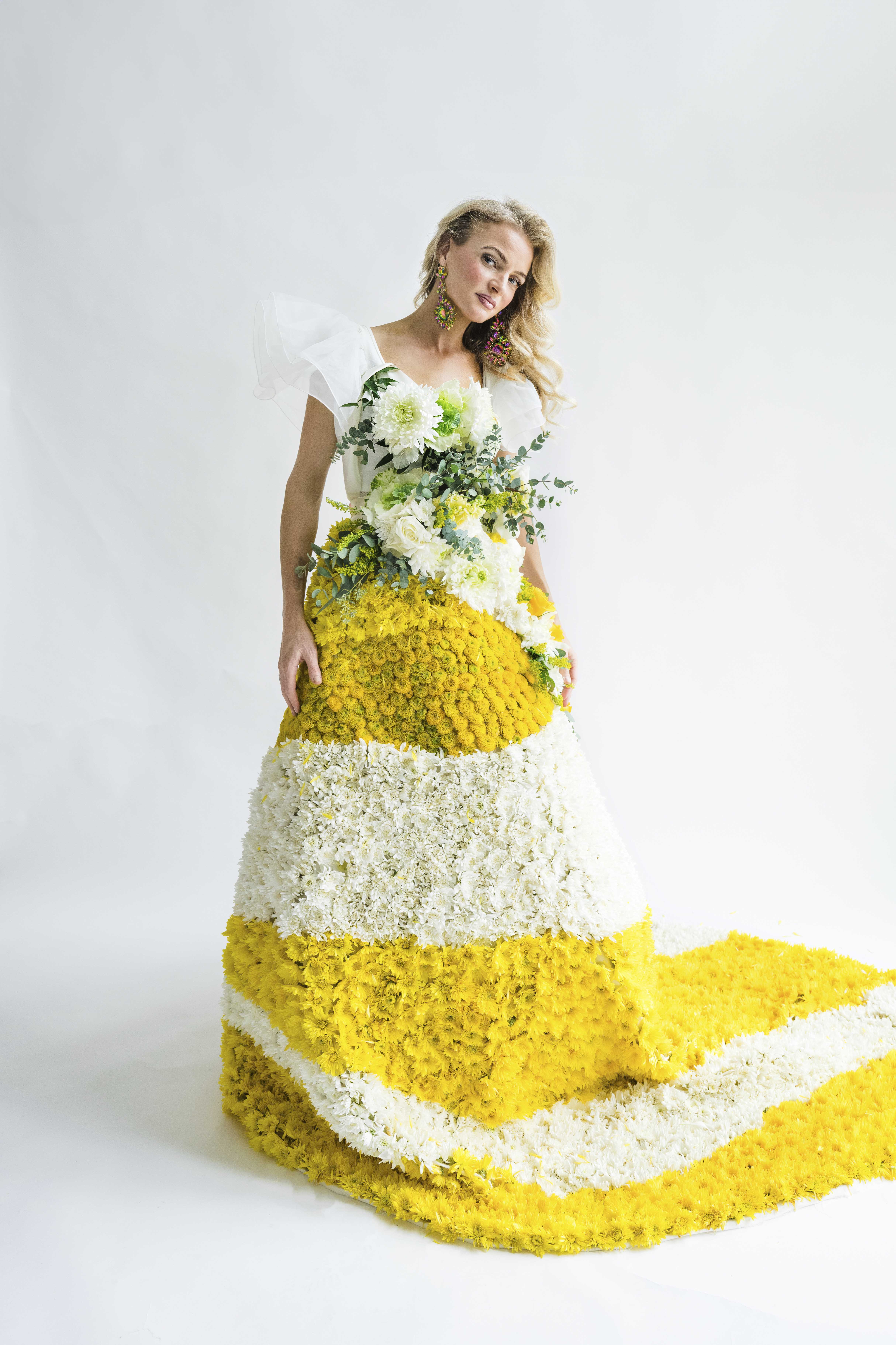 Mrs. Perry wearing the floral dress that she made with her father's funeral flowers.