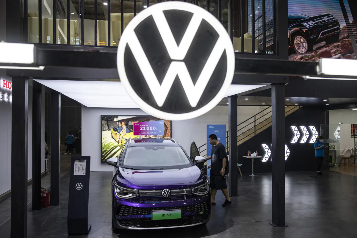 An attendee looks at the Volkswagen ID.6X during the 2022 Central China International Auto Show in Wuhan, in China's Hubei Province, on July 14, 2022. (Getty Images/Stringer)