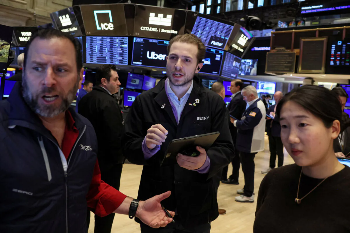 Traders work on the floor at the New York Stock Exchange (NYSE) in New York City, on Feb. 14, 2024. (Brendan McDermid/Reuters)