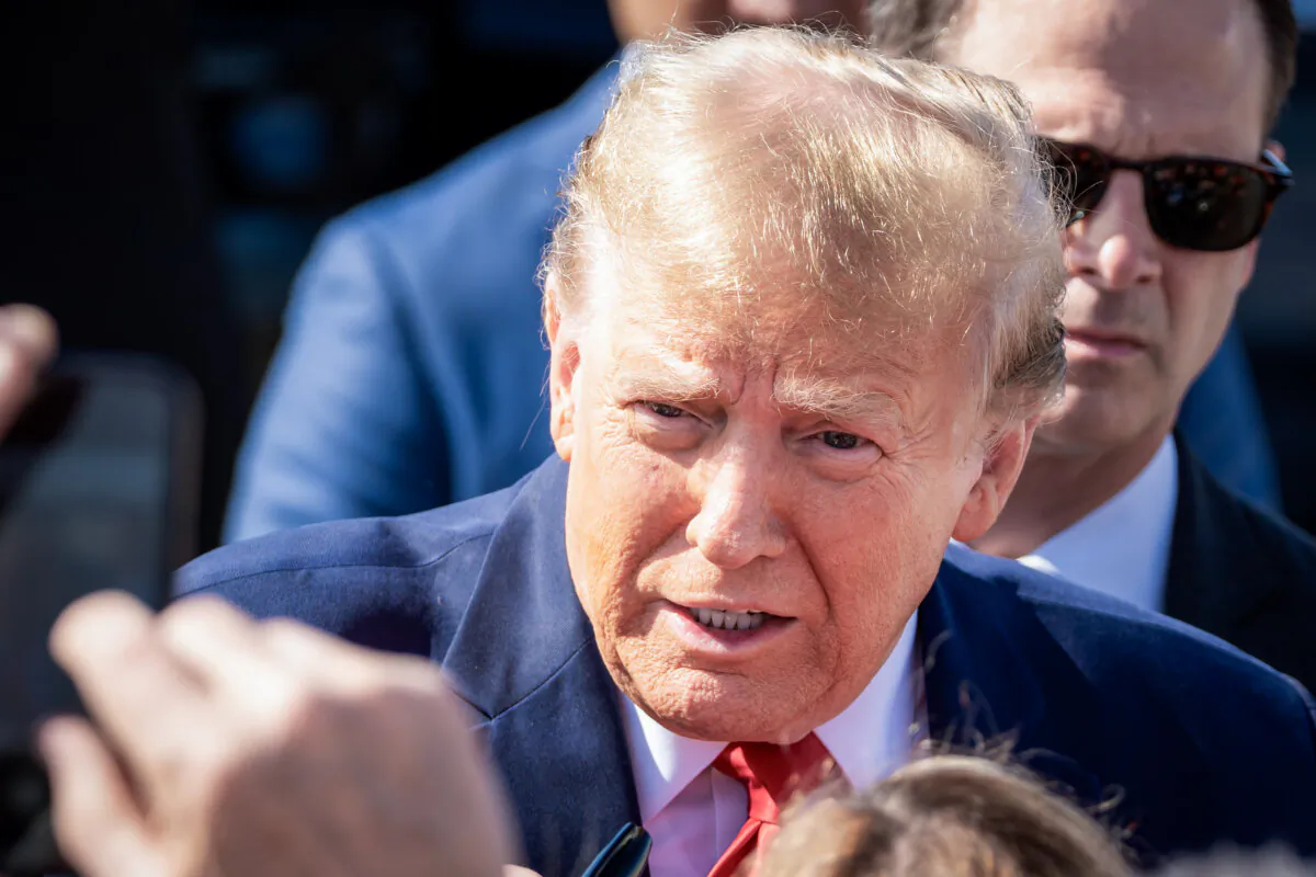 Republican presidential candidate and former President Donald Trump greets his supporters at Greenville-Spartanburg International Airport in Greer, S.C., on Feb. 20, 2024. (Madalina Vasiliu/The Epoch Times)