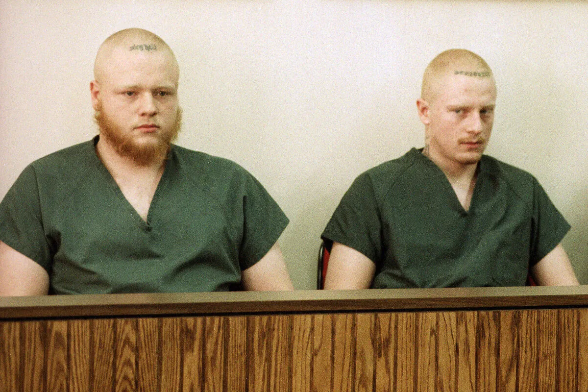 David Freeman, (L), and Bryan Freeman, (R), sit with Nelson Birdwell III, not pictured, as they appear in a Midland, Mich., courtroom, on March 2, 1995. (Dale Atkins/AP Photo)