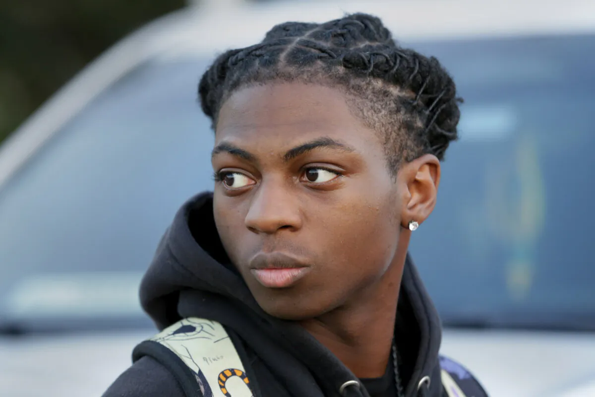 Darryl George, a 17-year-old junior, before walking across the street to go into Barbers Hill High School after serving a 5-day in-school suspension for not cutting his hair in Mont Belvieu, Texas, on Sept. 18, 2023. (Michael Wyke/AP Photo)