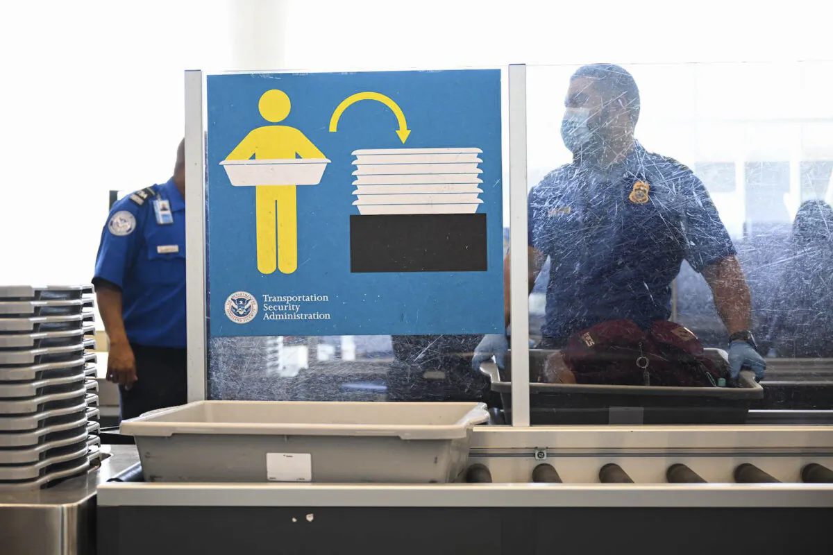 A Transportation Security Administration (TSA) agent screens carry-on baggage at Los Angeles International Airport (LAX) in Los Angeles, Calif., on Aug. 10, 2022. (Patrick T. Fallon/AFP via Getty Images)