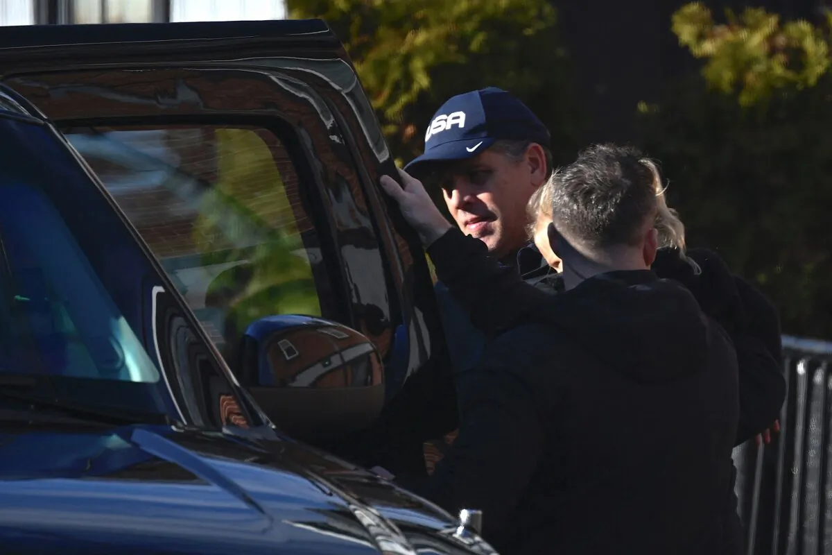 Hunter Biden leaves a restaurant, holding his son Beau, after lunch with President Joe Biden in Wilmington, Del., on Dec. 18, 2023. (Andrew Caballero-Reynolds/AFP via Getty Images)