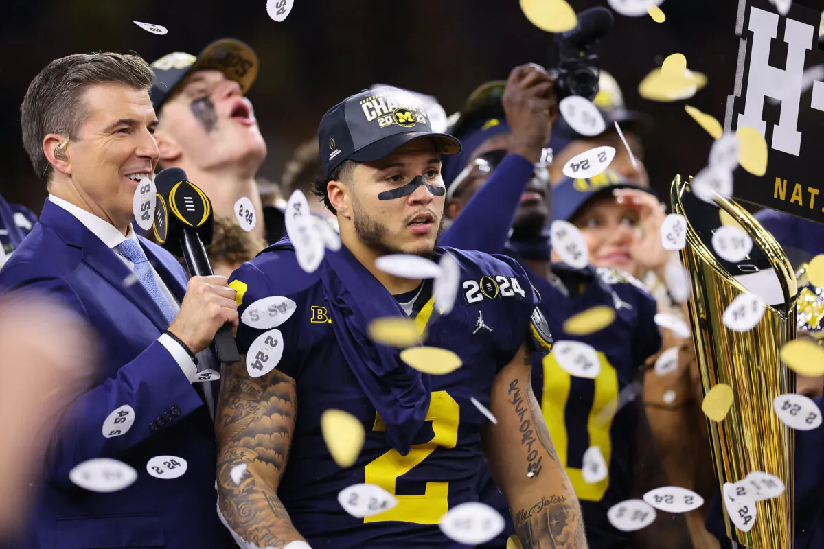 Blake Corum (2) of the Michigan Wolverines celebrates after defeating the Washington Huskies during the 2024 CFP National Championship game at NRG Stadium in Houston, Texas, on Jan. 8, 2024. Michigan defeated Washington 34-13. (Stacy Revere/Getty Images)