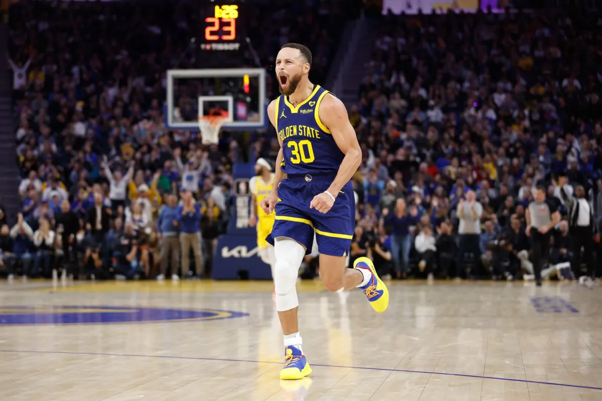 Stephen Curry (30) of the Golden State Warriors reacts after making a three-point shot in the first half against the Los Angeles Lakers in San Francisco on Feb. 22, 2024. (Lachlan Cunningham/Getty Images)