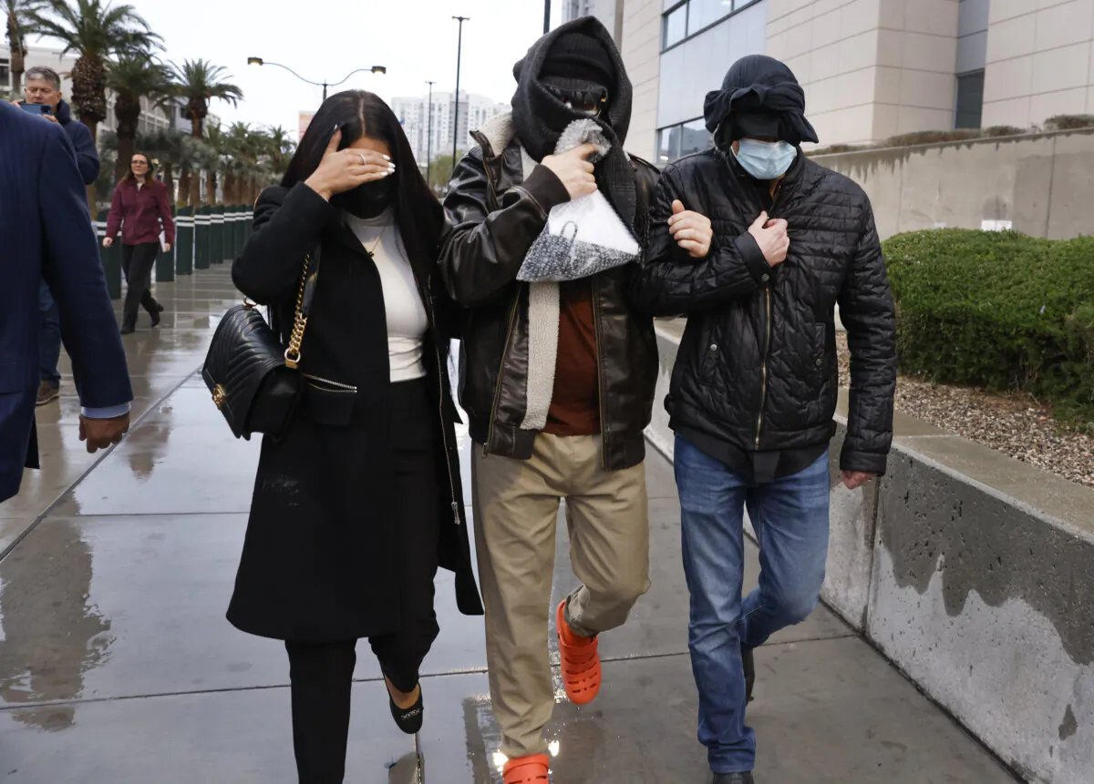 Former FBI informant Alexander Smirnov, center, leaves the courthouse in Las Vegas on Tuesday, Feb. 20, 2024. (Bizuayehu Tesfaye/Las Vegas Review-Journal via AP)