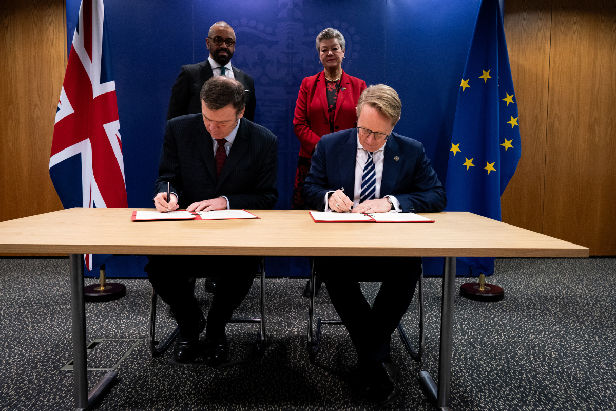 (front, left to right) Director General of Border Force Phil Douglas and Executive director of Frontex Hans Leijtens sign a document watched by (back, left to right) Home Secretary James Cleverly and European Commissioner for Home Affairs Ylva Johansson, at the Home Office, in central London, on Friday Feb. 23, 2024. (Aaron Chown/PA Media)