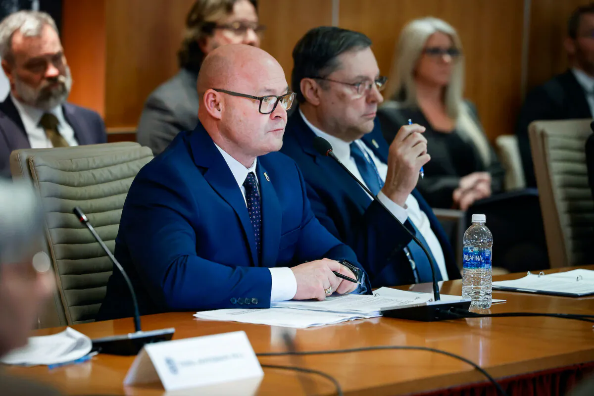 International Brotherhood of Teamsters General President Sean O’Brien (L) and General Secretary-Treasurer Fred Zuckerman listen to Republican presidential candidate and former U.S. President Donald Trump during a meeting at the union's headquarters in Washington on Jan. 31, 2024. (Chip Somodevilla/Getty Images)