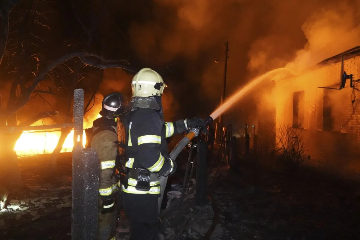 Firefighters extinguish a fire after a Russian attack on residential neighborhood in Kharkiv, Ukraine on Feb. 10, 2024. (The Canadian Press/AP-Andrii Marienko)
