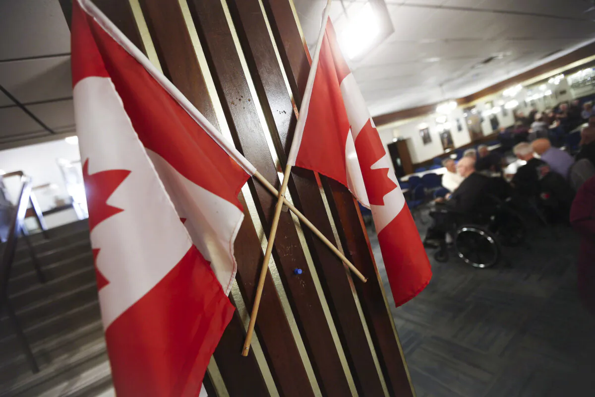 Canadian flags are displayed at a Royal Canadian Legion in Winnipeg on Nov. 8, 2018. (THE CANADIAN PRESS/John Woods)
