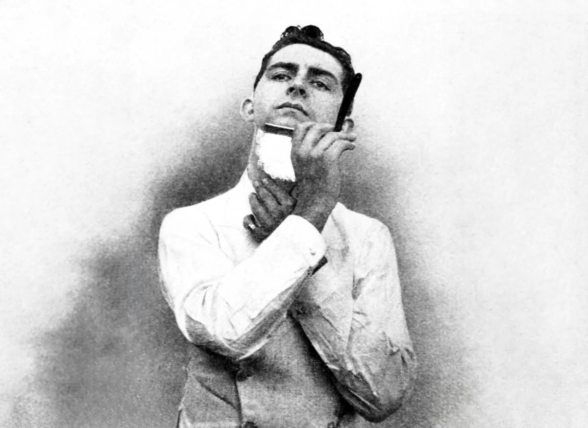 A vintage illustration of a man shaving with a straight razor. (X3A Collection/Alamy Stock Photo)