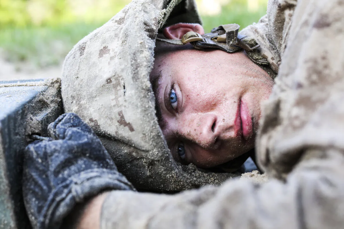 A recruit advances towards the next objective in a simulated battle during "the Crucible," on Marine Corps Recruit Depot Parris Island, South Carolina, on Aug. 22, 2019. The Crucible tests recruits mentally and physically, and is the final step in earning the title United States Marine. (Lance Cpl. Ryan Hageali, U.S. Marine Corps)
