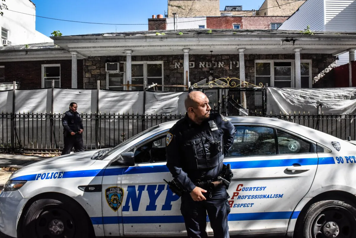 Members of the New York Police Department patrol in front of a synagogue in the Williamsburg neighborhood in the borough of Brooklyn in New York on Oct. 13, 2023. (Stephanie Keith/Getty Images)