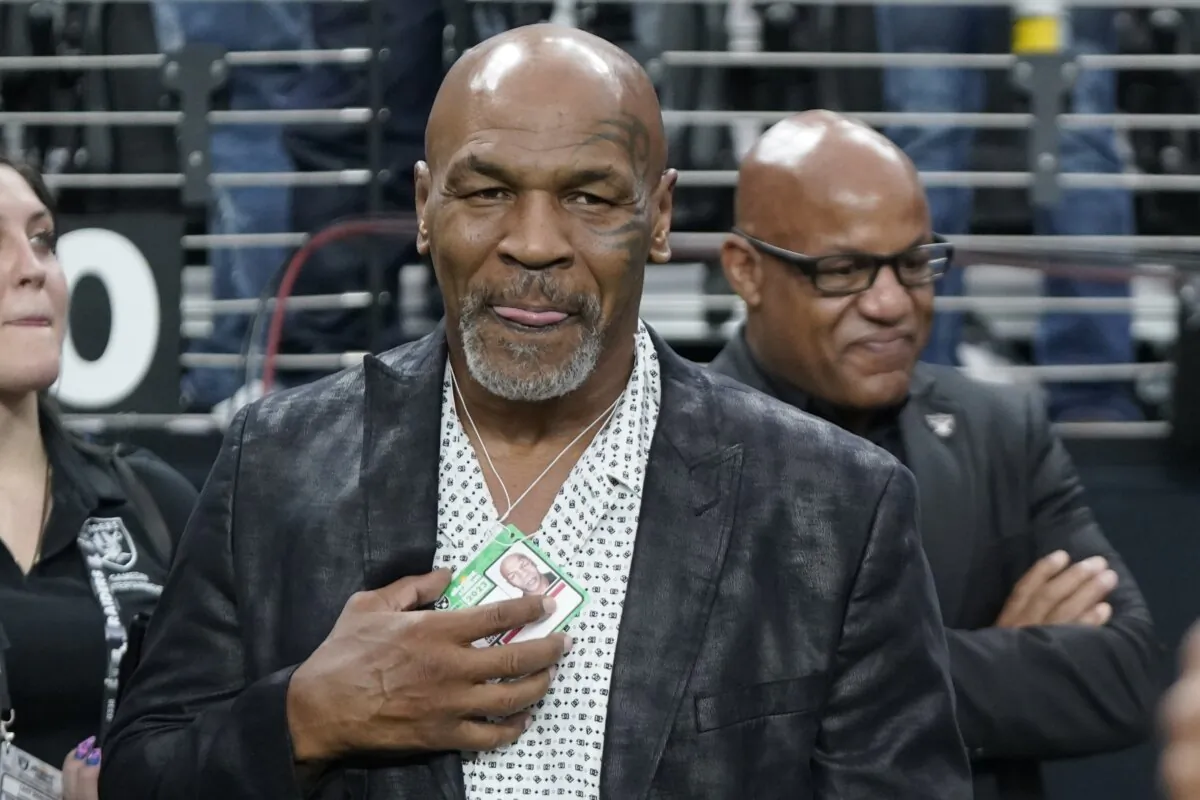 Former heavyweight boxing champion Mike Tyson stands on the field before an NFL football game between the Las Vegas Raiders and the Pittsburgh Steelers in Las Vegas on Sept. 24, 2023. (Mark J. Terrill/AP Photo)
