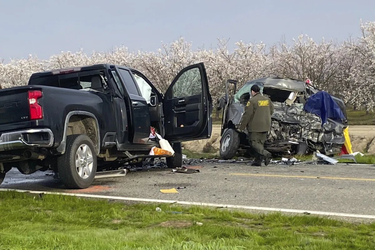 The site of a head-on crash involving a van and a pickup truck where eight people were killed is checked in Madera County, Calif., on Feb. 23, 2024. (Anthony Galaviz/The Fresno Bee via AP)