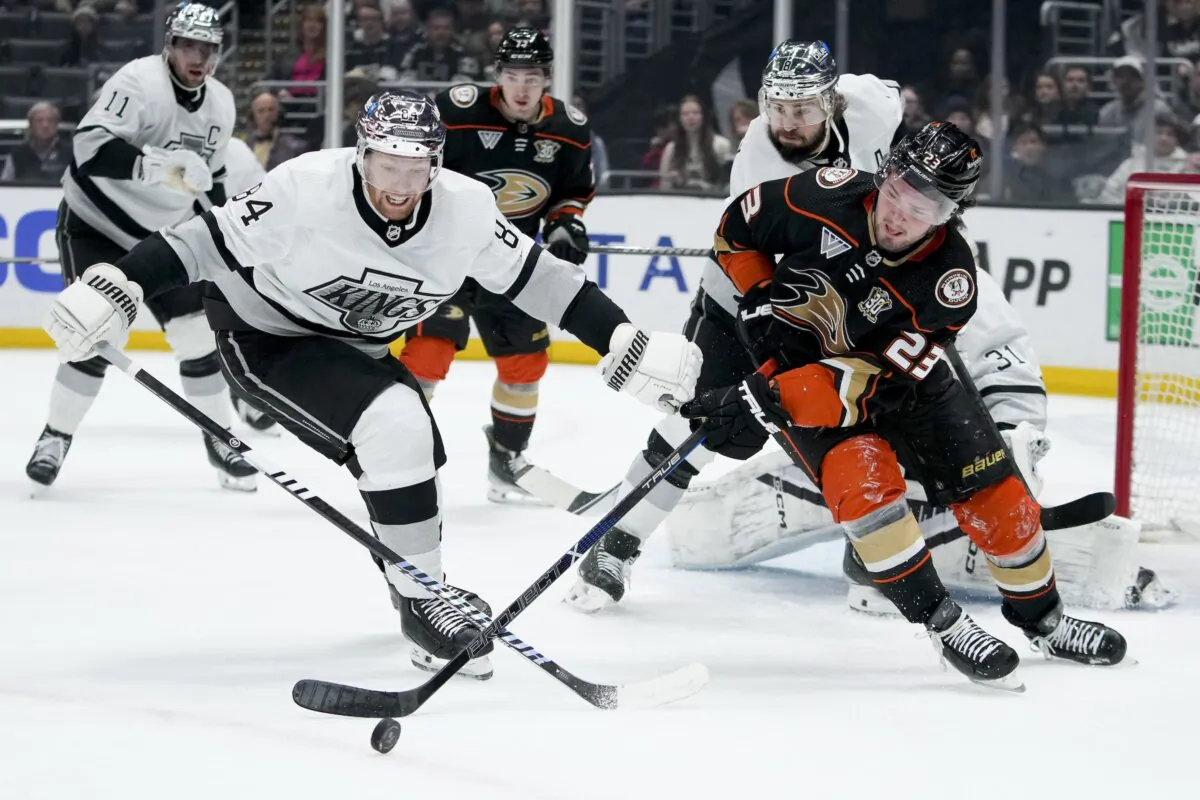 Los Angeles Kings defenseman Vladislav Gavrikov (L) and Anaheim Ducks center Mason McTavish vie for the puck during the first period of an NHL hockey game in Los Angeles on Feb. 24, 2024. (Ryan Sun/AP Photo)