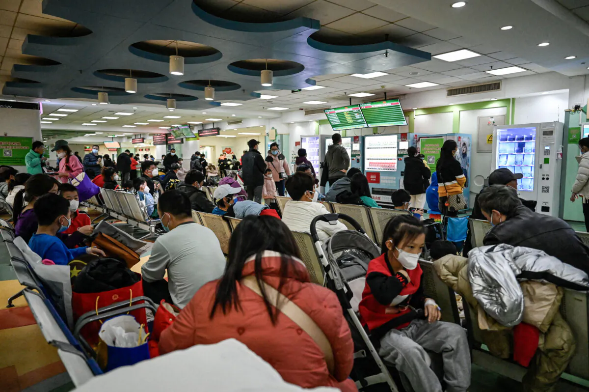 Children and their parents wait at an outpatient area at a children hospital in Beijing, on Nov. 23, 2023.  (Jade Gao / AFP via Getty Images)
