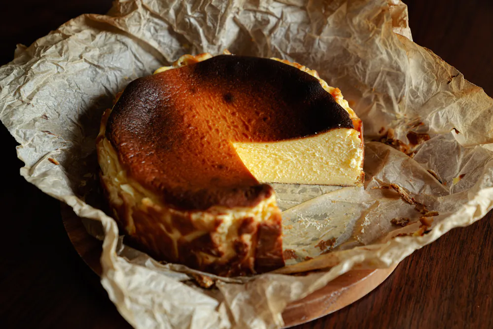 Unlike traditional cheesecakes, Basque cheesecake is characterized by its dark, caramelized exterior and light, creamy interior.(pic0000/Shutterstock)