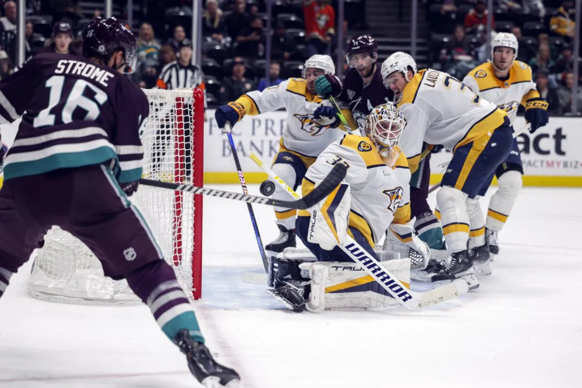 Anaheim Ducks center Ryan Strome (16) bats the puck as Nashville Predators goalie Kevin Lankinen (32) (front R) watches during the third period of an NHL hockey game in Anaheim, Calif., on Feb. 25, 2024. (Yannick Peterhans/AP Photo)