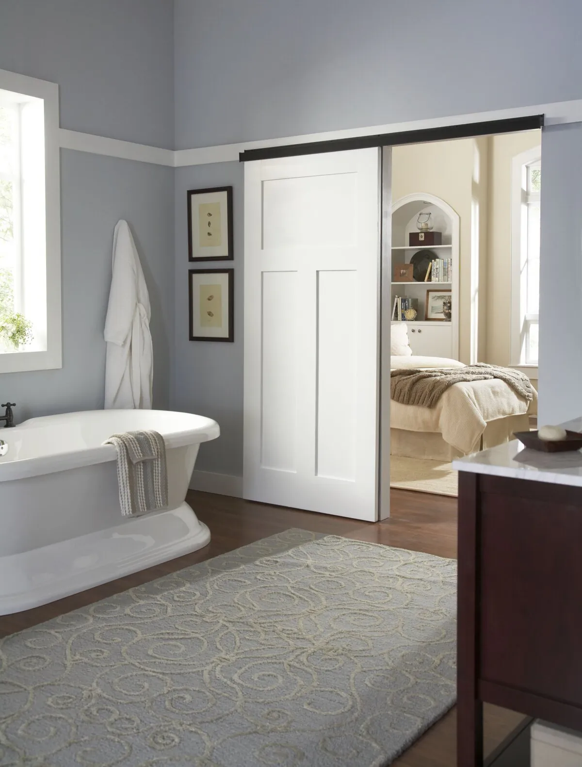 It’s a good choice in a tight space where there’s not enough swing room for a standard hinged door. (Johnson Hardware/TNS)