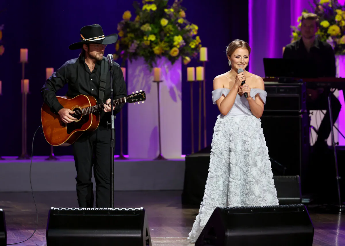 Lukas Nelson and Emmy Rose Russell perform onstage for CMT Coal Miner's Daughter: A Celebration of the Life & Music of Loretta Lynn at Grand Ole Opry in Nashville, Tenn., on Oct. 30, 2022. (Terry Wyatt/Getty Images for CMT)