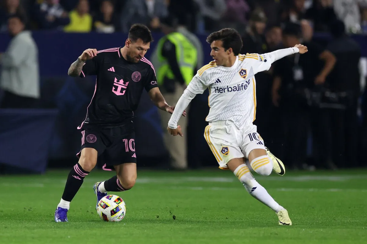 Lionel Messi (10) of Inter Miami dribbles past the defense of Riqui Puig (10) of Los Angeles Galaxy during the first half of a game in Carson, Calif., on Feb. 25, 2024. (Sean M. Haffey/Getty Images)