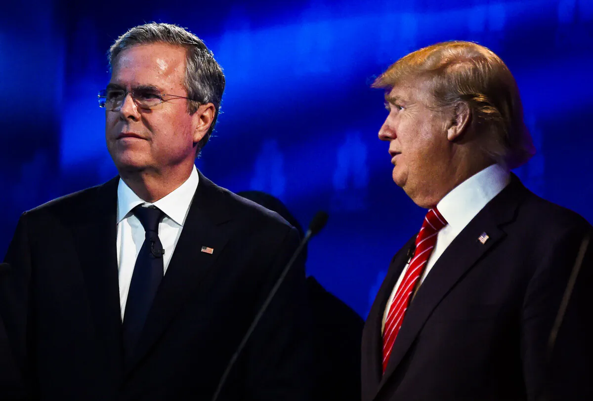 Then-Republican presidential hopefuls Donald Trump (R) and Jeb Bush look on during a break in the CNBC Republican Presidential Debate at the Coors Event Center at the University of Colorado in Boulder, Colorado, on Oct. 28, 2015. (Robyn Beck/AFP via Getty Images)