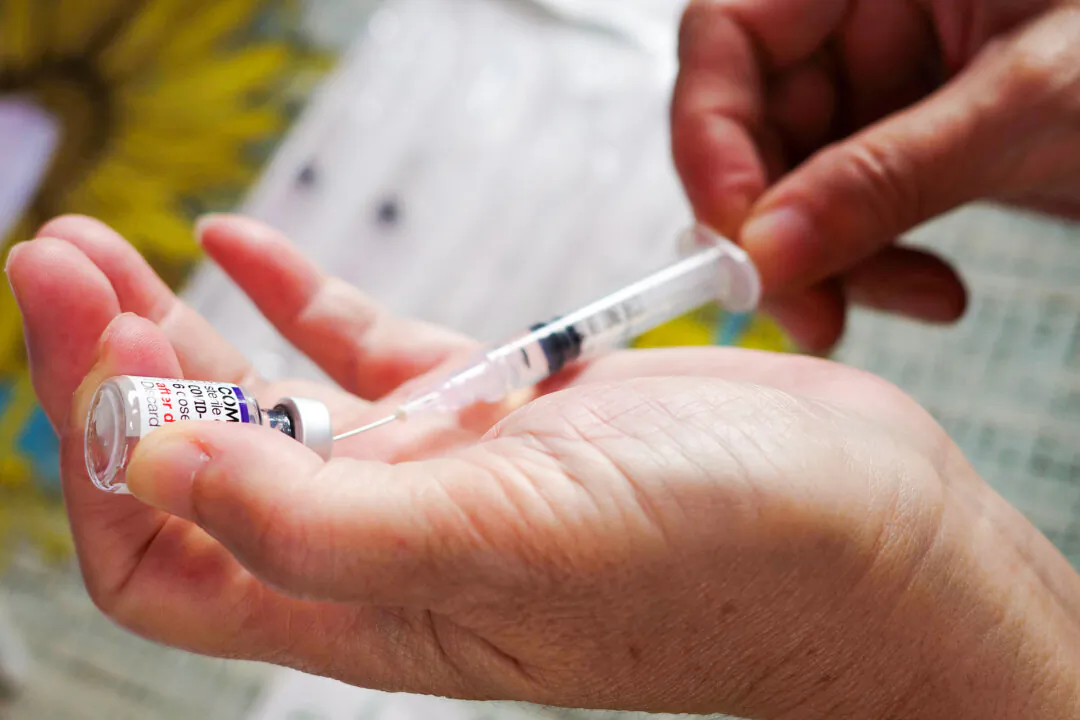 A health worker prepares a dose of Pfizer COVID-19 coronavirus vaccine at a health center in Jakarta on Feb. 1, 2023. (Bay Ismoyo/AFP via Getty Images)