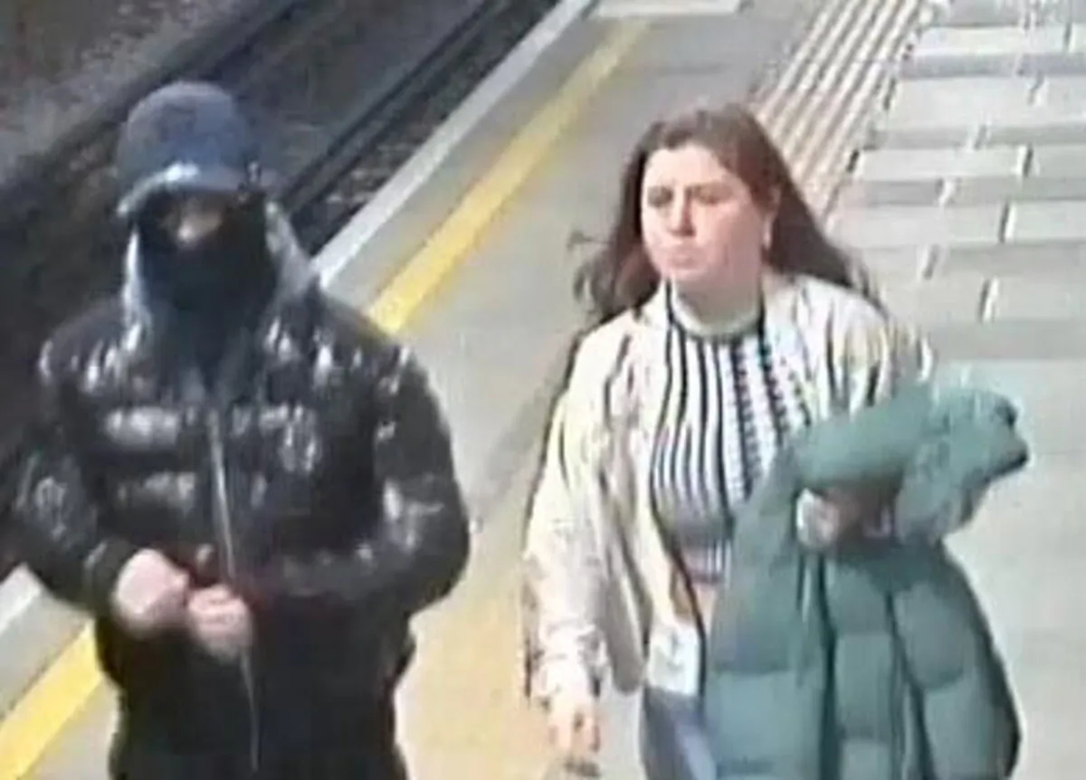 A screengrab from CCTV footage of two people suspected of involvement in an attack with a corrosive substance at Elm Park station in east London on Feb. 25, 2024. (British Transport Police)