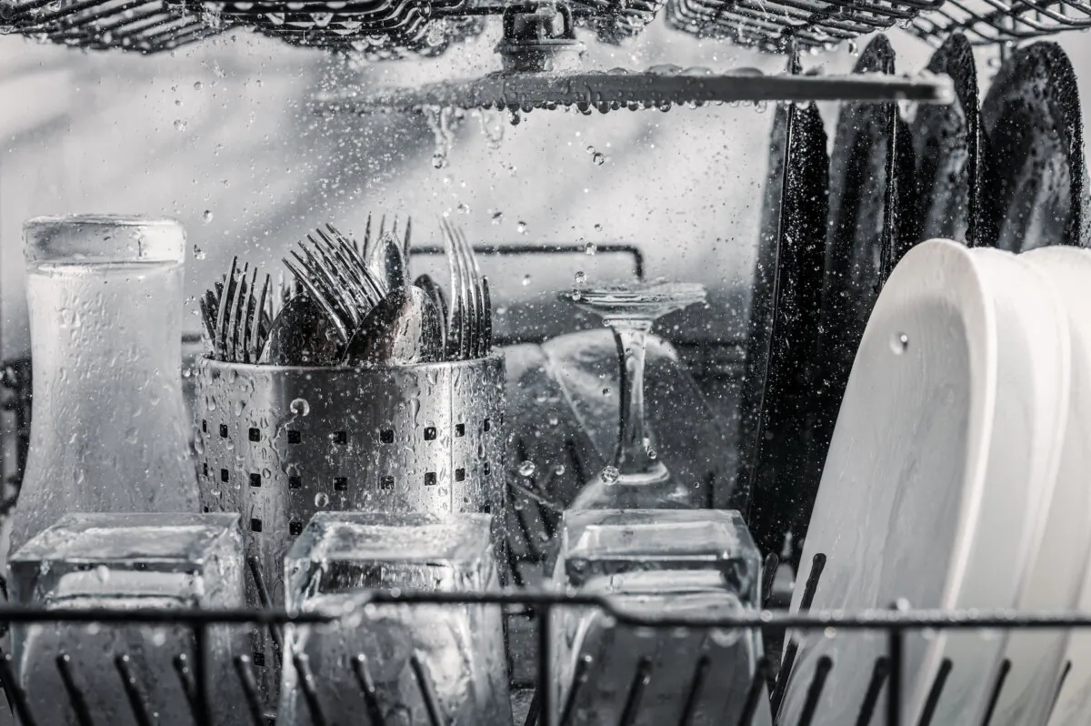 Dishwashers are energy efficient and disinfect the dishes every time. (Malikov Aleksandr/Shutterstock)