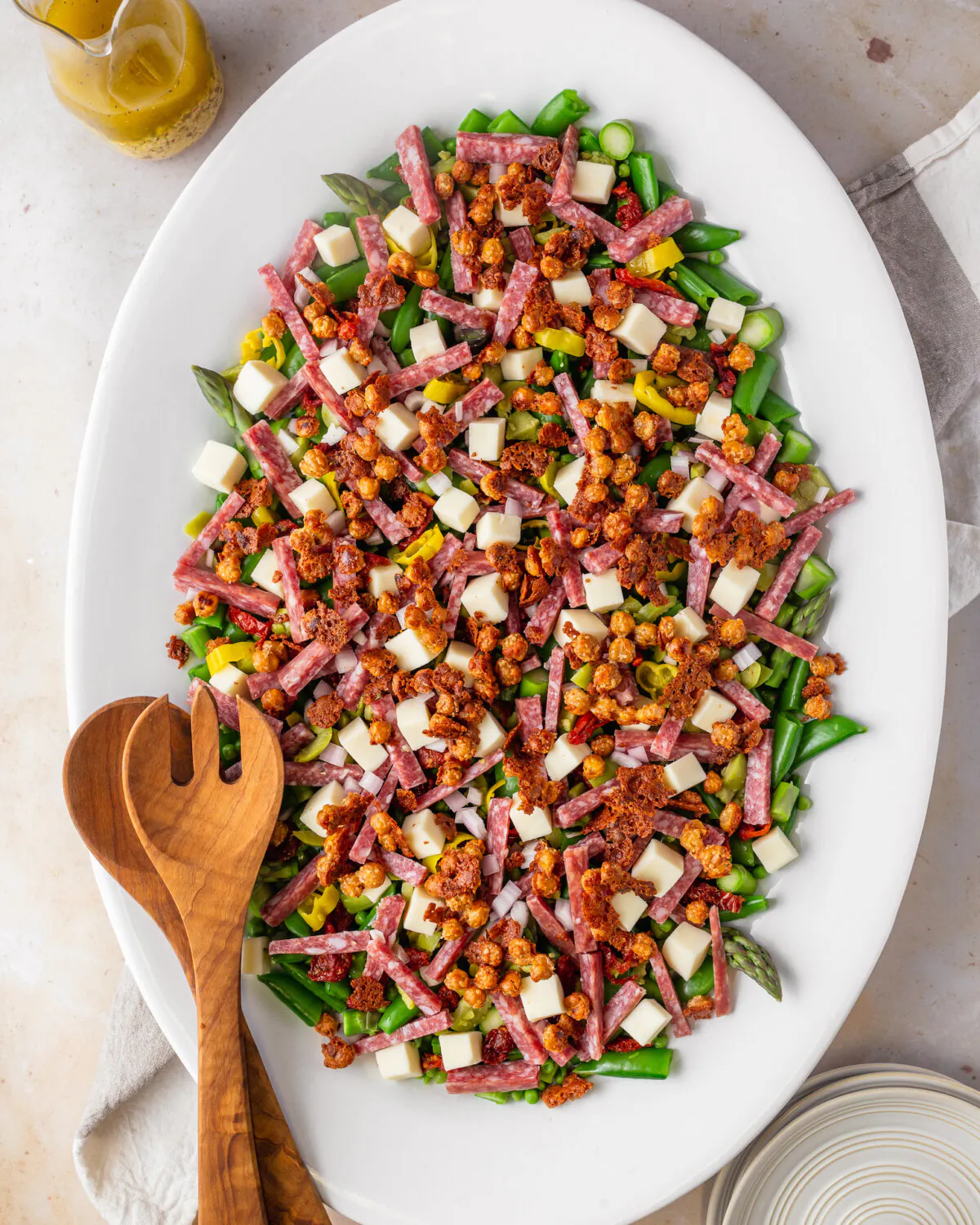 This springy vegetable medley is topped with crispy Parmesan chickpeas and Italian dressing. (Meleyna Nomura/TNS)
