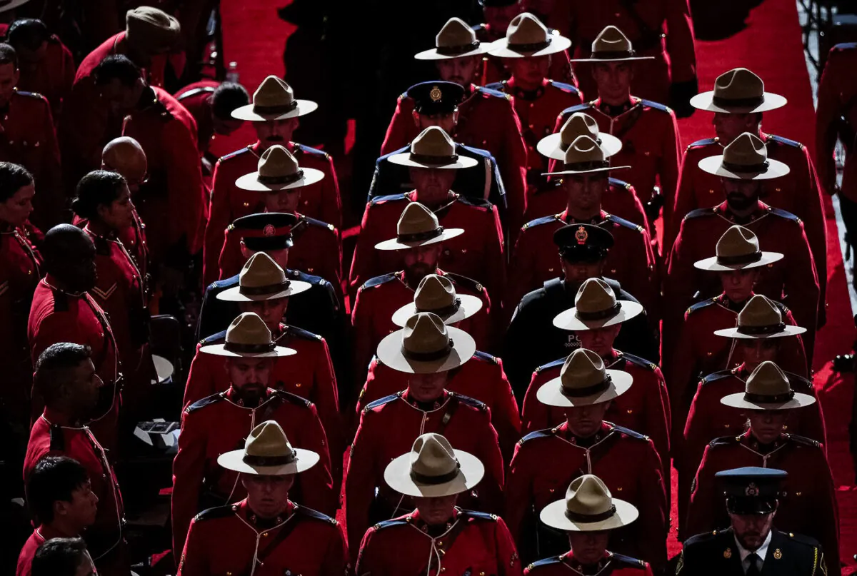 RCMP officers depart after a regimental funeral for RCMP Const. Rick O'Brien in Langley, B.C., on Oct. 4, 2023. (The Canadian Press/Darryl Dyck)