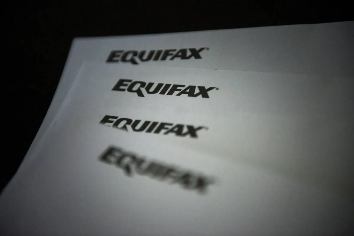 Equifax letterhead are shown on paper in Toronto on Oct.17, 2019. (The Canadian Press/Christopher Katsarov)