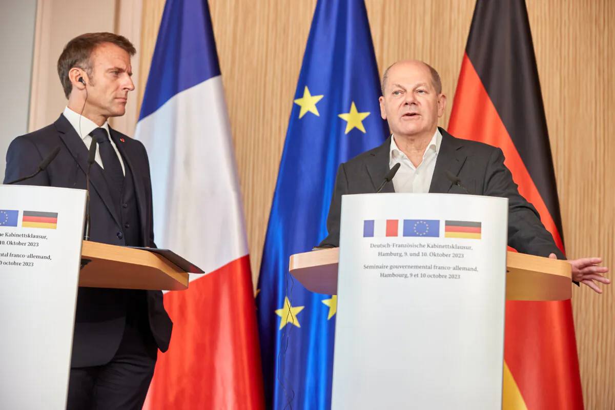 (L–R) French President Emmanuel Macron and German Chancellor Olaf Scholz speak to the media during a press conference on the second day of a two-day German-French government retreat in Hamburg, Germany, on Oct. 10, 2023. (Georg Wendt/Getty Images)