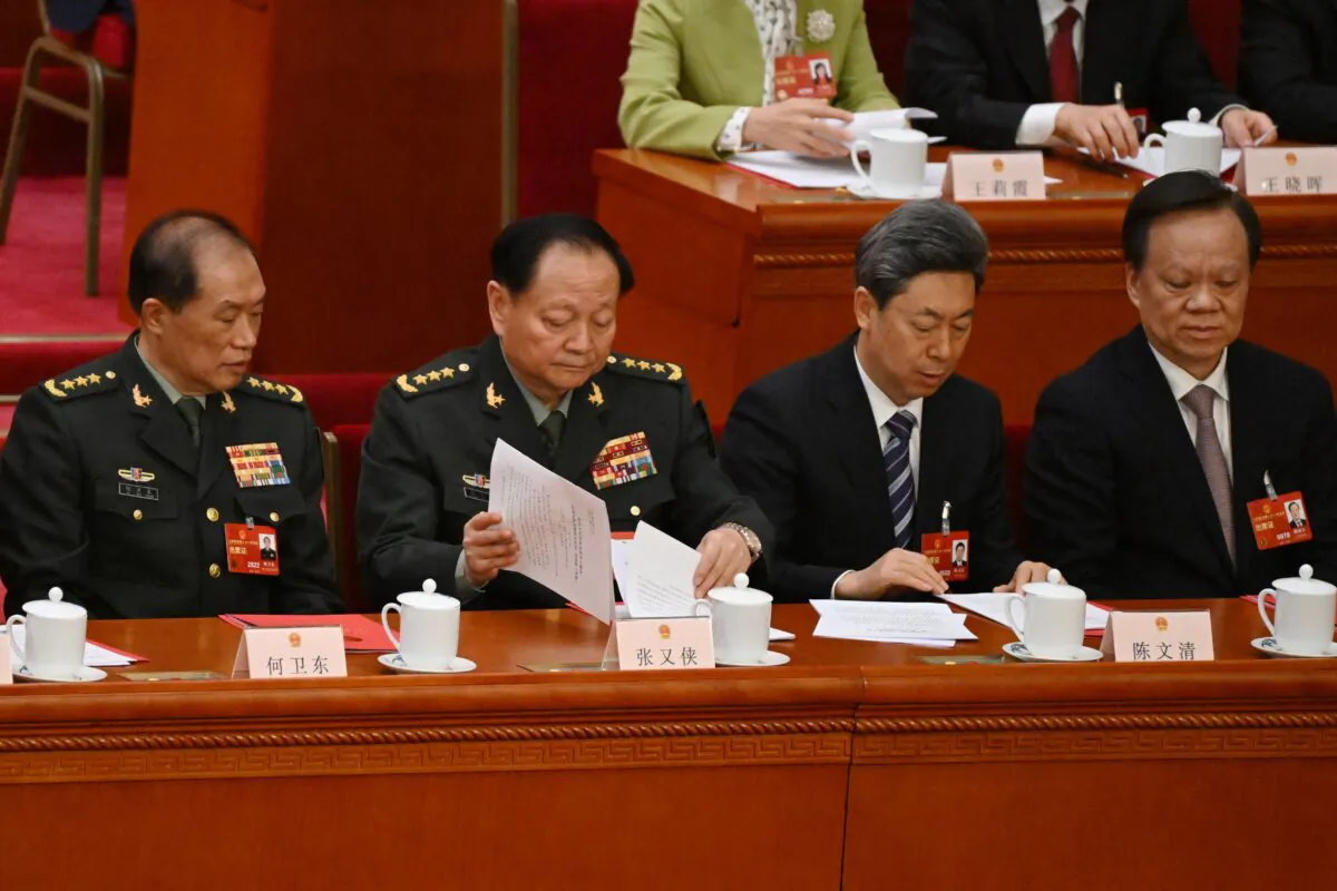 (L-R) Vice Chairmen of the Central Military Commission of the People's Republic of China He Weidong and Zhang Youxia, Central Committee Political Bureau member Chen Wenqing, and Tianjin Communist Party Secretary Chen Miner attend the closing session of the National People's Congress at the Great Hall of the People in Beijing on March 13, 2023. (Noel Celis/Pool/AFP/via Getty Images)