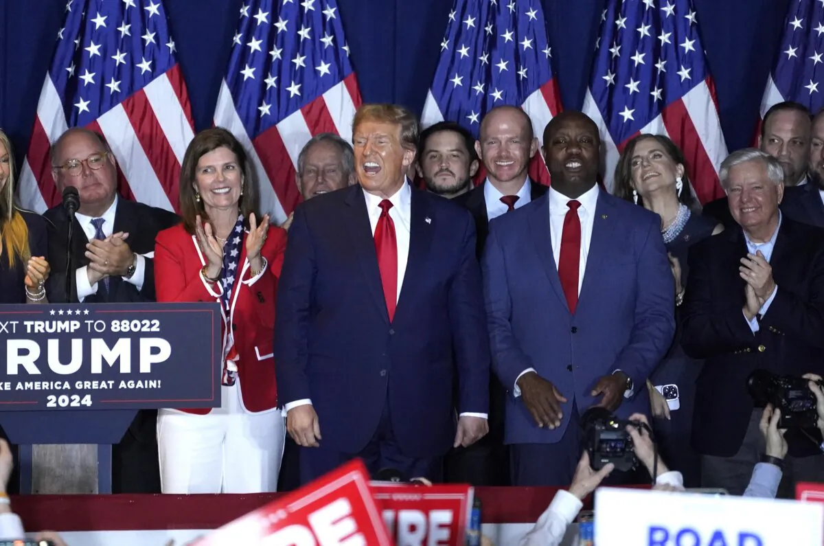Former presidential hopeful and 2024 presidential hopeful Donald Trump (C) reacts at an "Election Night Watch Party" in Columbia, S.C., on Feb. 24, 2024. (Timothy A. Clary/AFP via Getty Images)