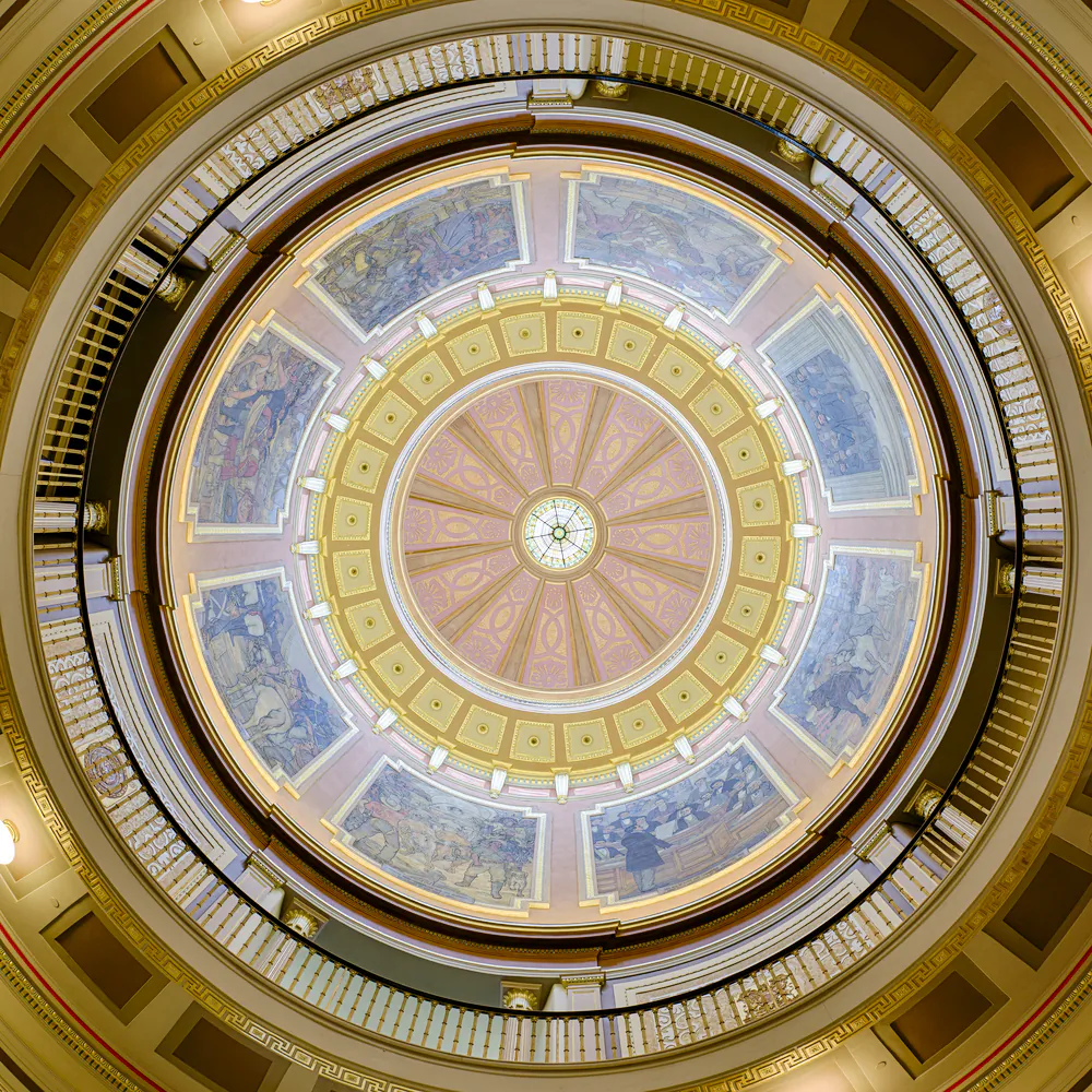 While the original interior of the Capitol’s dome was whitewashed and plain, an early 20th century renovation (1906–07) resulted in the rotunda space gaining ornate moldings and cornices as well as a stained-glass skylight. Then, from 1927 to 1930, eight large murals showcasing important points in Alabama’s history were painted and installed as mixed media on canvas by Scottish-born artist, Roderick Mackenzie, who maintained a studio in Mobile, Ala. (Nagel Photography/Shutterstock)
