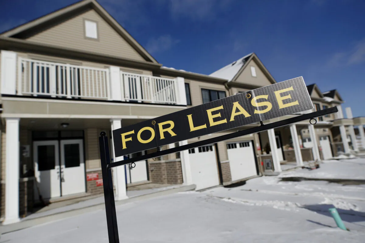 A 'For Lease' sign stands in front of a row of houses in a newly build subdivision in East Gwillimbury in the greater Toronto area, on Jan. 30, 2018. (Reuters/Mark Blinch)