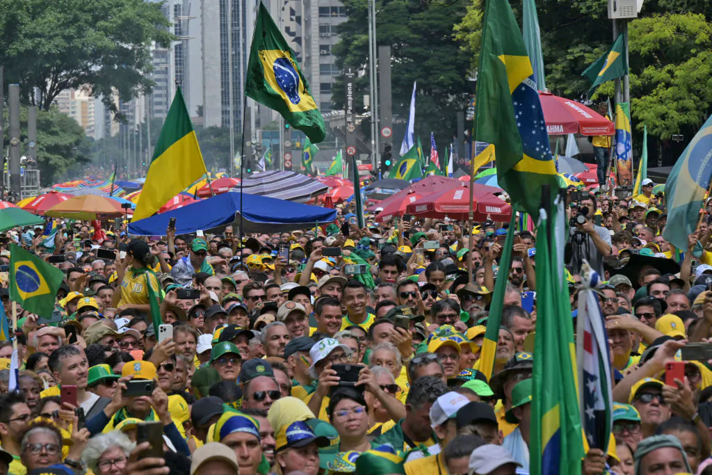 Supporters of former Brazilian President Jair Bolsonaro (2019-2022) attend a rally in Sao Paulo, Brazil, on Feb. 25, 2024, to reject claims he plotted a coup with allies to remain in power after his failed 2022 reelection bid. (Nelson Almeida/AFP via Getty Images)
