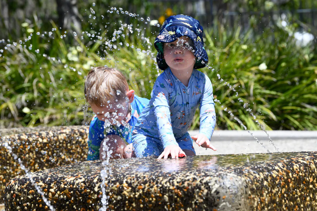 Young Bodhi Collins cools off at a water park in Yarrabilba, west of Brisbane, Australia on Nov. 30, 2023. (AAP Image/Jono Searle)